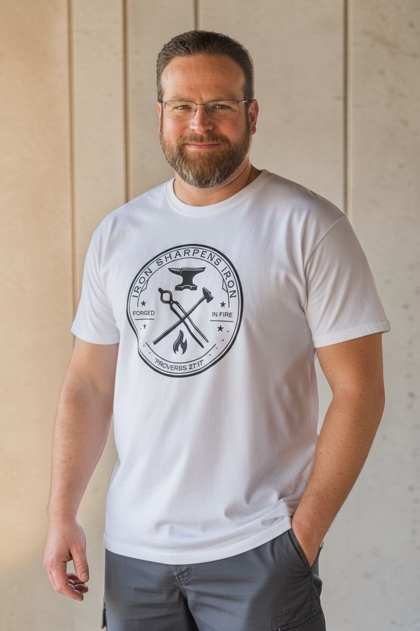 Man wearing white Iron Sharpens Iron Forged in Fire Christian t-shirt with Proverbs 27:17 design